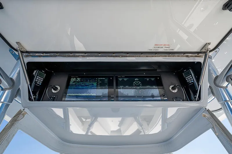 Slide: The Image of 2017 Bahama 41 boat dashboard with advanced navigation and communication systems. - 30