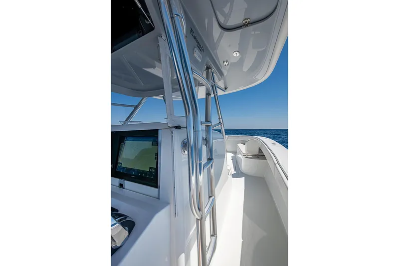 Slide: The Image of 2017 Bahama 41 boat interior with navigation screen and ocean view. - 31