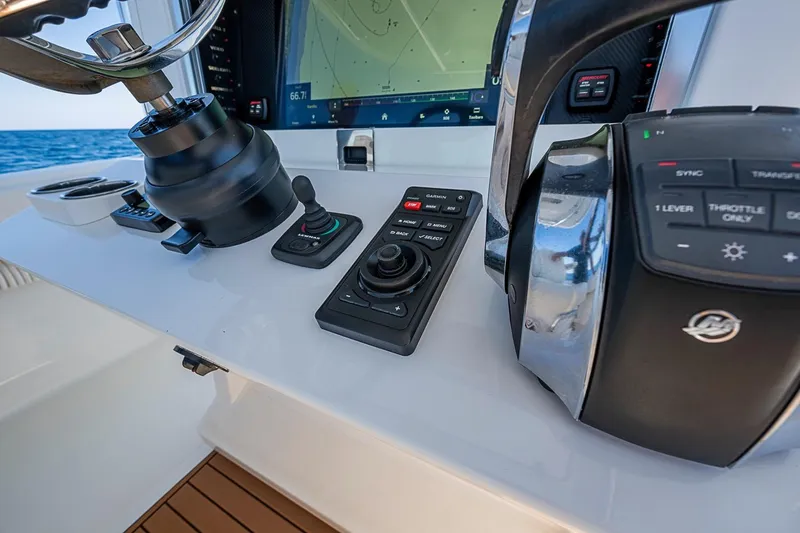 Slide: The Image of Control panel of a 2017 Bahama 41 boat with navigation equipment. - 32