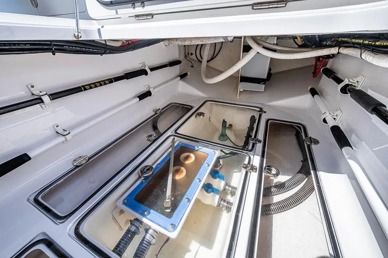 Slide: The Image of Interior view of a 2017 Bahama 41 boat's storage compartment with fishing rod holders. - 35