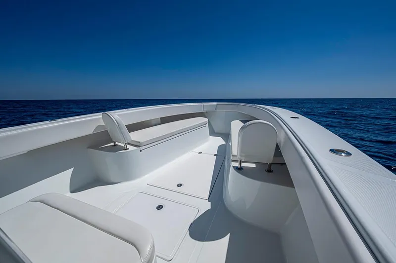 Slide: The Image of 2017 Bahama 41 boat deck with seating, under clear blue sky and ocean view. - 38
