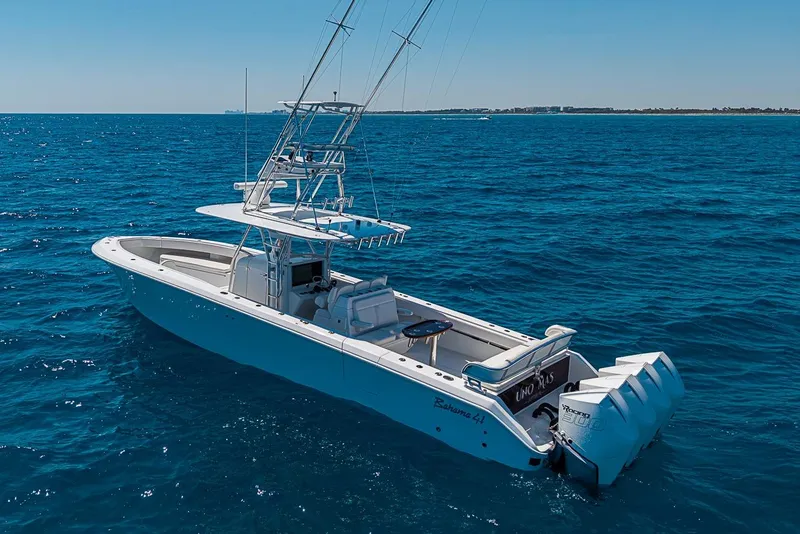 Slide: The Image of 2017 Bahama 41 boat on open sea with multiple outboard engines. - 4