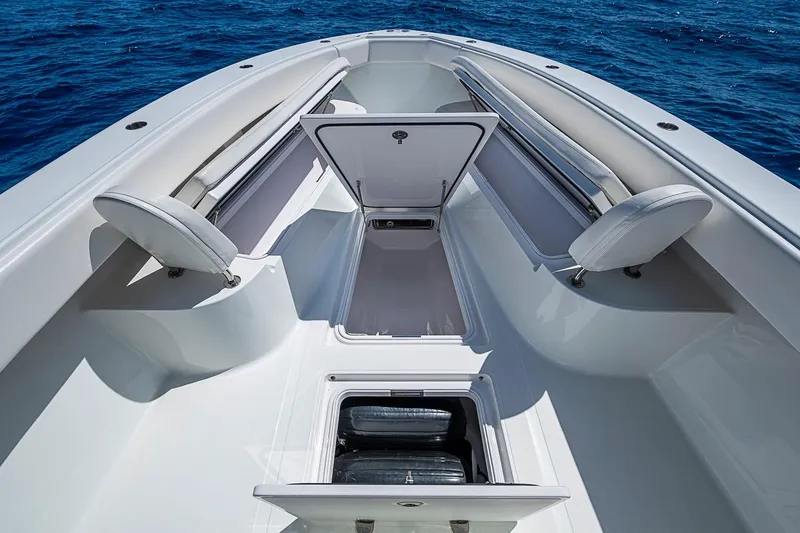 Slide: The Image of 2017 Bahama 41 boat interior with open storage compartments, set against a deep blue ocean backdrop. - 40