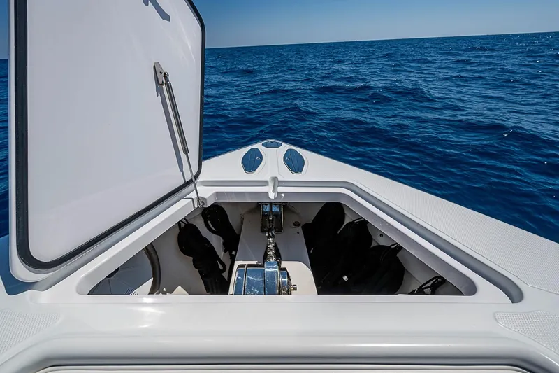 Slide: The Image of Open hatch on 2017 Bahama 41 boat, revealing storage, with ocean view. - 41