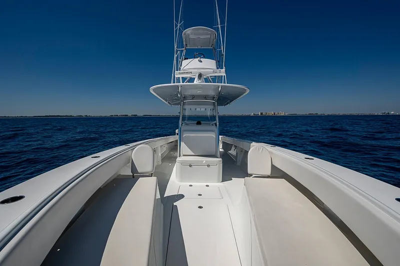 Slide: The Image of 2017 Bahama 41 boat on open sea under clear blue sky. - 42