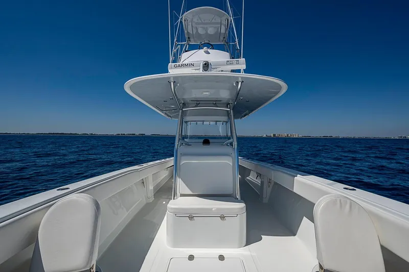 Slide: The Image of 2017 Bahama 41 boat on open sea under clear blue sky. - 43