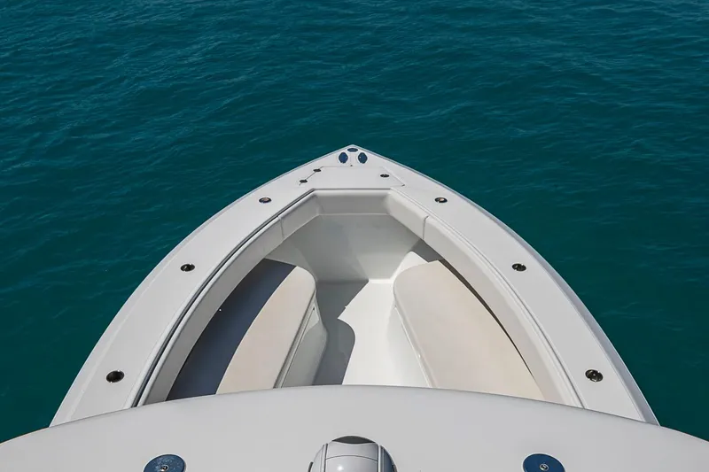 Slide: The Image of Bow view of 2017 Bahama 41 boat on clear blue water. - 48