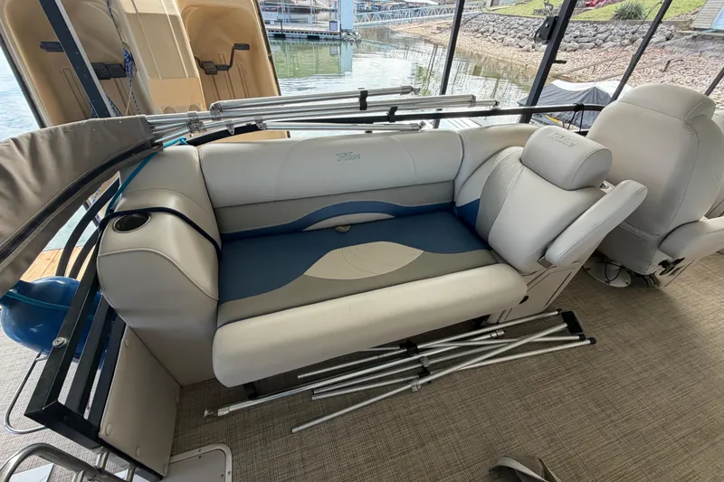 Slide: The Image of Interior of a 2018 JC 25 Neptoon TT Sport boat with cushioned seating. - 14