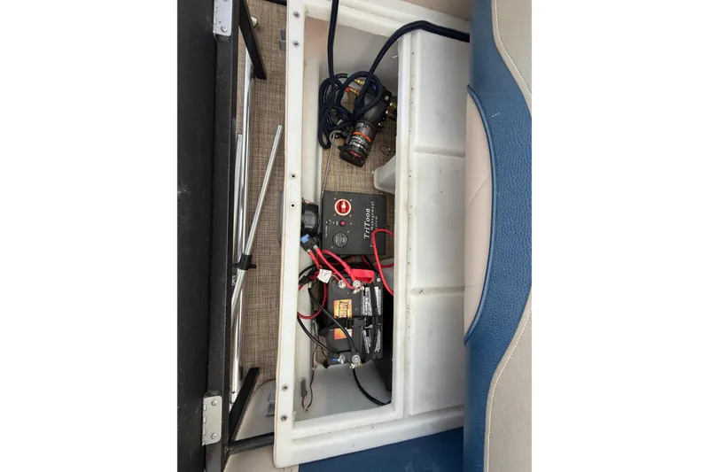 Slide: The Image of 2018 JC 25 Neptoon TT Sport boat battery compartment with wiring and components. - 22