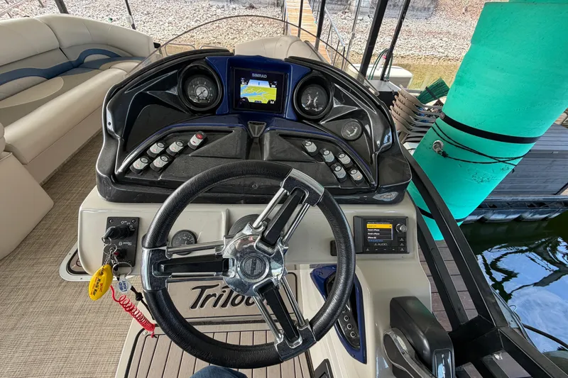 Slide: The Image of Steering console of 2018 JC 25 Neptoon TT Sport pontoon boat with navigation display. - 26