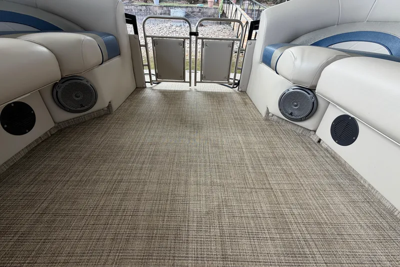 Slide: The Image of Interior of 2018 JC 25 Neptoon TT Sport pontoon boat with beige seating and speakers. - 27