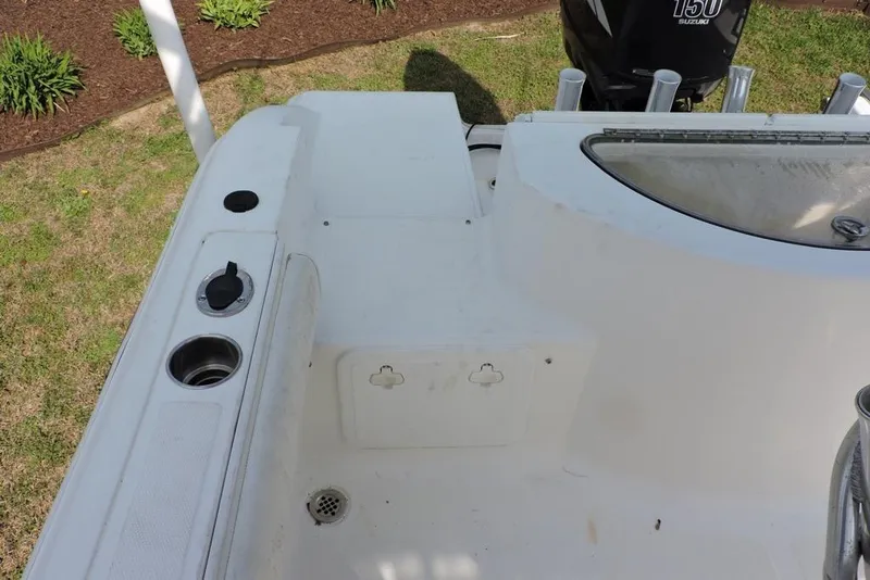 Slide: The Image of 2007 Sea Fox 216 Center Console boat interior with cup holders and storage compartments. - 10
