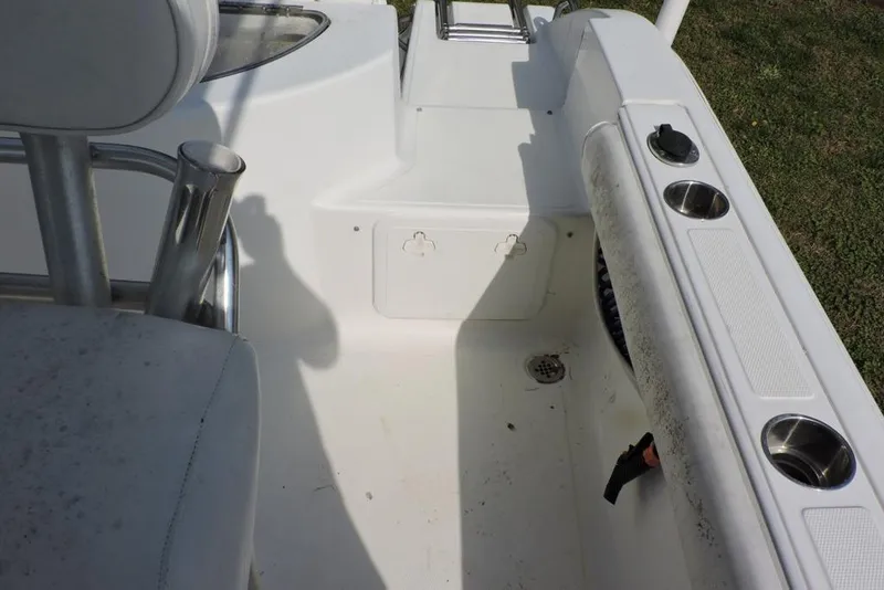 Slide: The Image of 2007 Sea Fox 216 Center Console boat interior with seating and cup holders. - 11