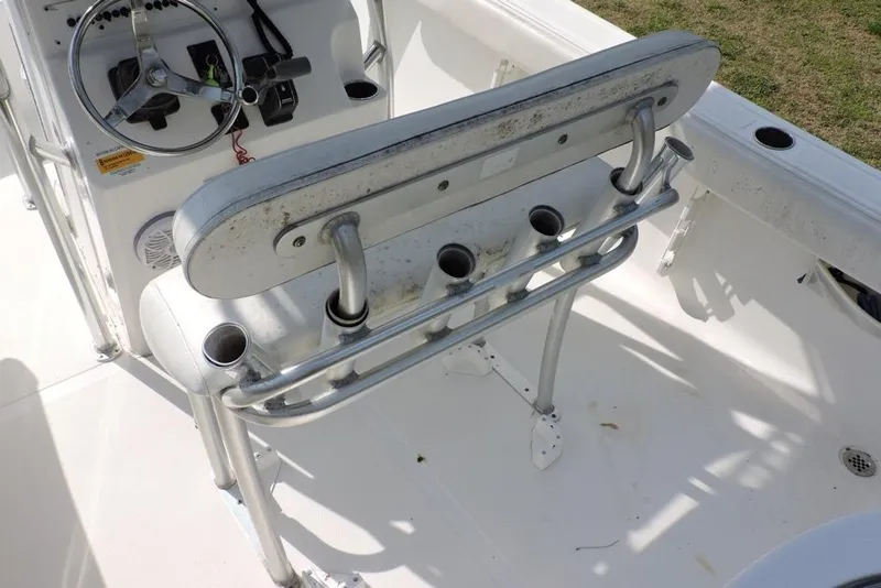 Slide: The Image of 2007 Sea Fox 216 Center Console boat interior with steering wheel and rod holders. - 12