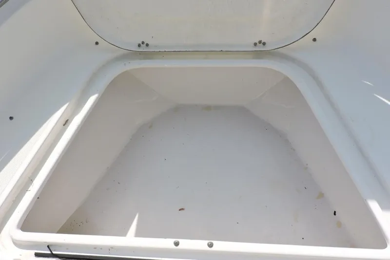 Slide: The Image of Storage compartment of a 2007 Sea Fox 216 Center Console boat, empty and clean. - 16