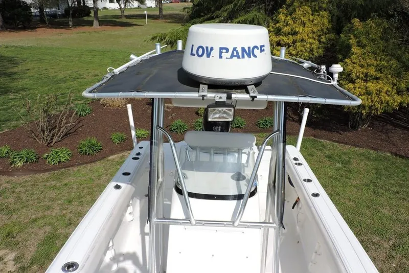 Slide: The Image of 2007 Sea Fox 216 Center Console boat with radar, parked on grass. - 18
