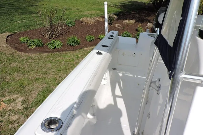 Slide: The Image of 2007 Sea Fox 216 Center Console boat interior with rod holders and clean deck. - 21