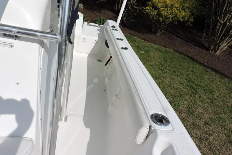 Slide: The Image of 2007 Sea Fox 216 Center Console boat interior with rod holders and clean deck. - 22