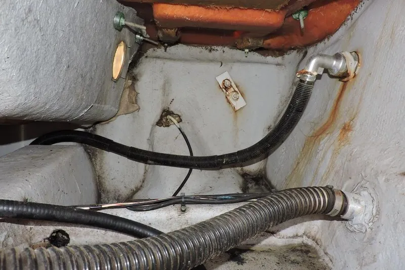 Slide: The Image of Bilge area of a 2007 Sea Fox 216 Center Console boat showing hoses and fittings. - 28