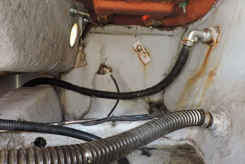 Slide: The Image of 2007 Sea Fox 216 Center Console boat interior showing hoses and fittings. - 29