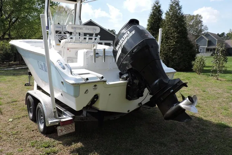 Slide: The Image of 2007 Sea Fox 216 Center Console boat with Suzuki outboard motor on trailer. - 3