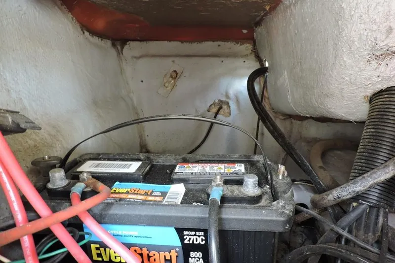 Slide: The Image of Battery compartment of a 2007 Sea Fox 216 Center Console boat with EverStart battery. - 32