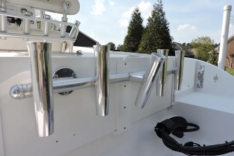 Slide: The Image of Rod holders on a 2007 Sea Fox 216 Center Console boat, with trees in the background. - 33