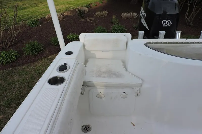 Slide: The Image of 2007 Sea Fox 216 Center Console boat interior with seating and Suzuki 150 engine. - 35