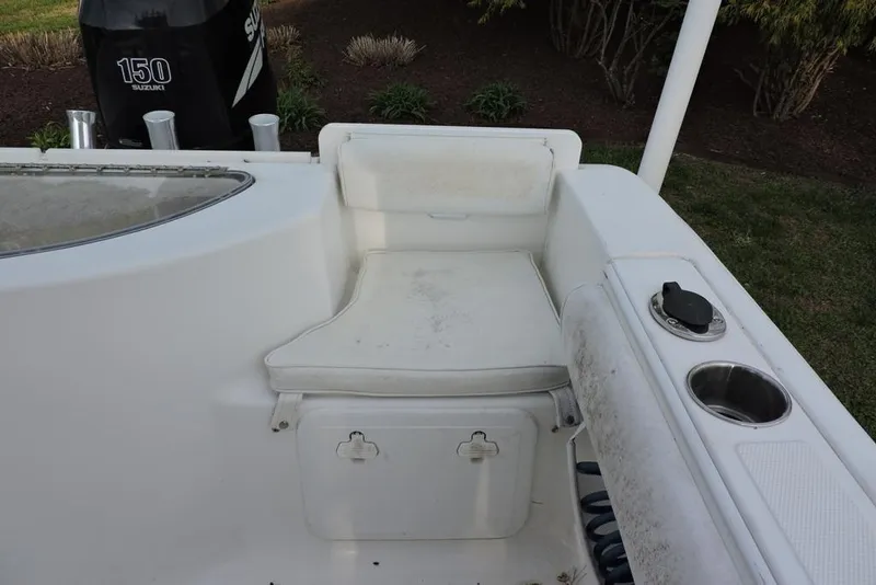 Slide: The Image of 2007 Sea Fox 216 Center Console boat interior with seating and Suzuki 150 engine. - 36