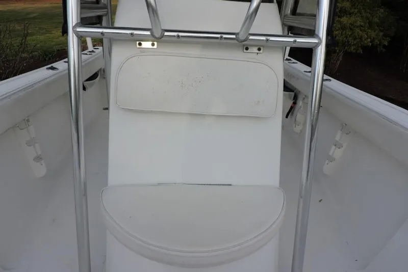 Slide: The Image of 2007 Sea Fox 216 Center Console boat interior with white seating and metal railings. - 37