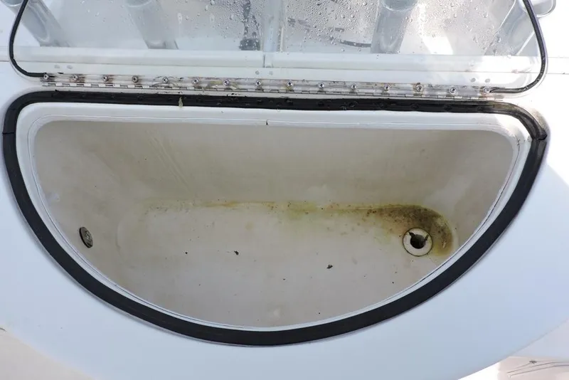 Slide: The Image of Open storage compartment on a 2007 Sea Fox 216 Center Console boat. - 8