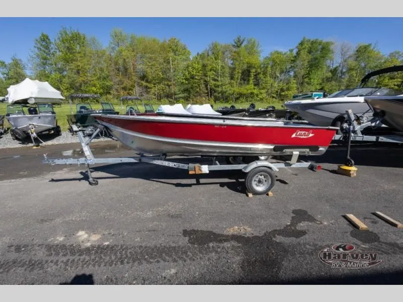 The Image of Red WC 14 boat from 2026 parked on trailer outdoors. - 1