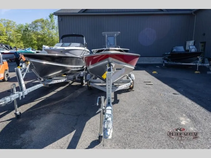 Slide: The Image of Boats on trailers outside a building, model WC 14, year 2026. - 3