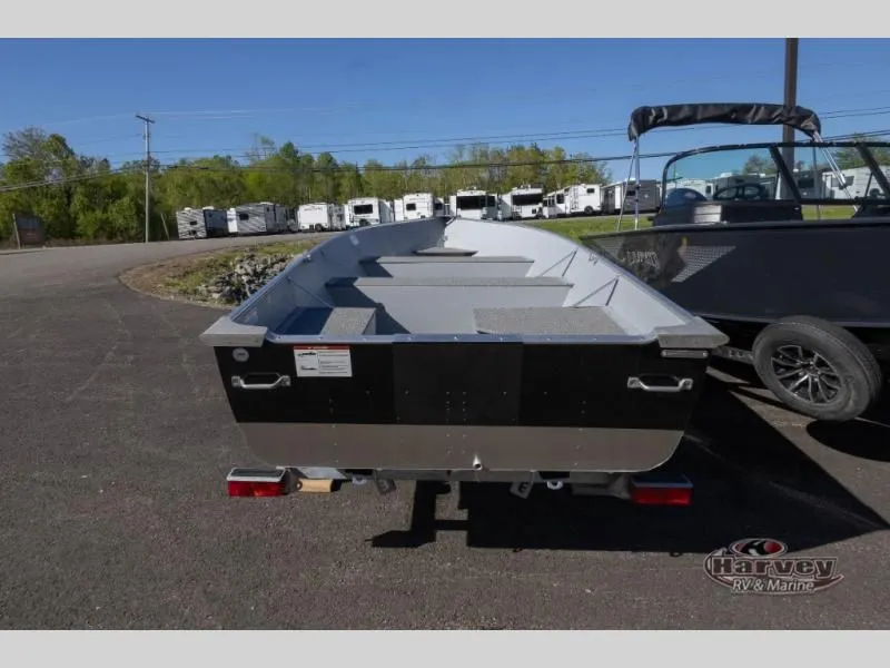 Slide: The Image of Rear view of a 2026 WC 14 boat model in a parking lot. - 3