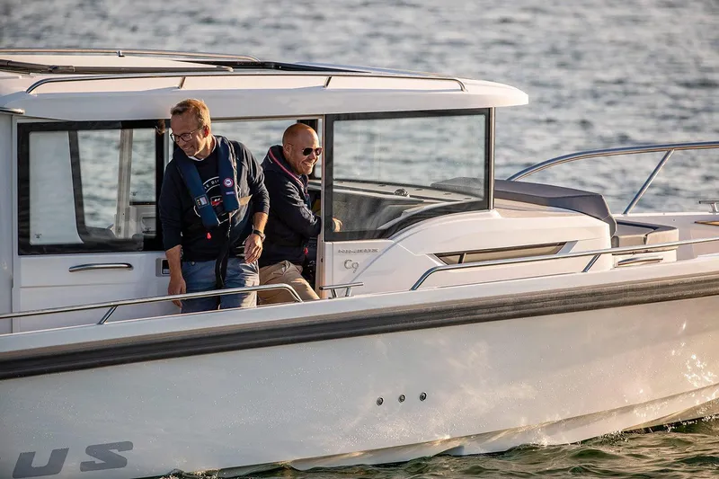 The Image of Manufacturer Provided Image: 2026 Nimbus Commuter 9 boat on water with two passengers. - 2