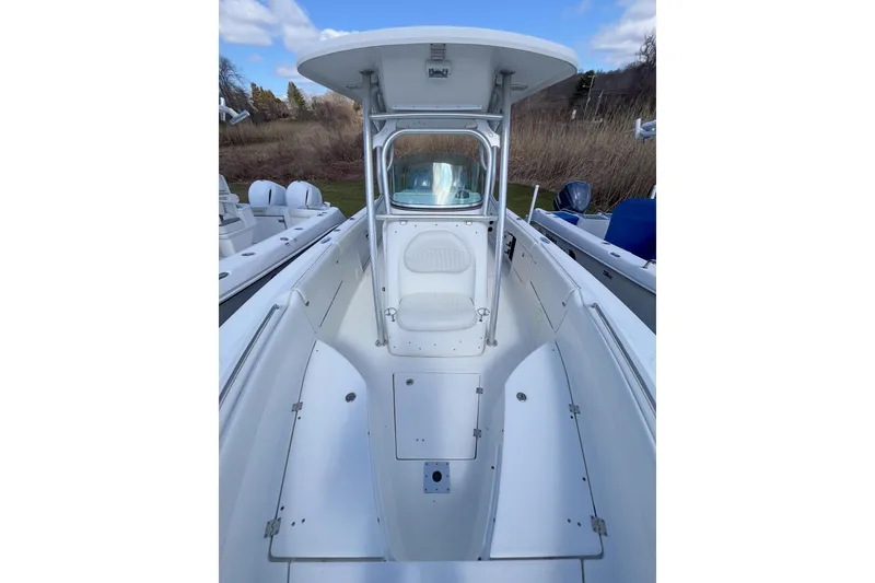Slide: The Image of 2008 Robalo R260 Center Console boat with spacious deck and seating. - 11