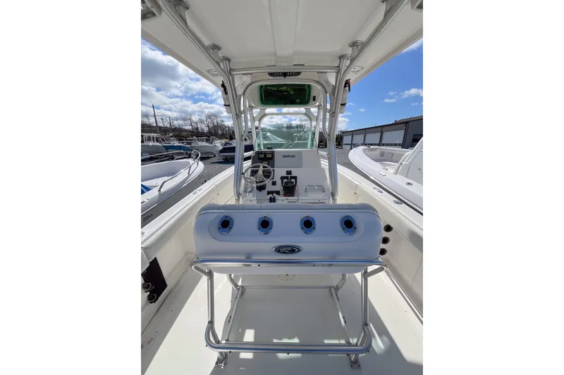 Slide: The Image of 2008 Robalo R260 Center Console boat interior with steering wheel and controls. - 4