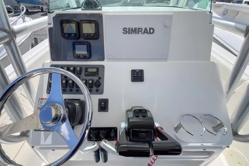 Slide: The Image of 2008 Robalo R260 Center Console helm with Simrad electronics and Yamaha controls. - 6