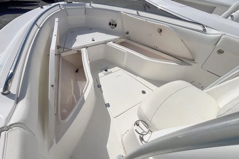 Slide: The Image of 2008 Robalo R260 Center Console boat interior with seating and storage compartments. - 8