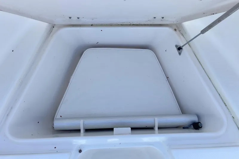 Slide: The Image of Storage compartment of 2008 Robalo R260 Center Console boat, open lid view. - 9