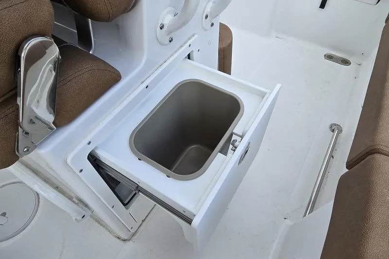 Slide: The Image of Built-in storage compartment on 2026 Sea Hunt Ultra 265 SE boat. - 11
