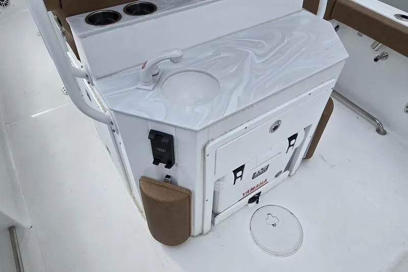 Slide: The Image of Interior of 2026 Sea Hunt Ultra 265 SE boat with sink and storage. - 4