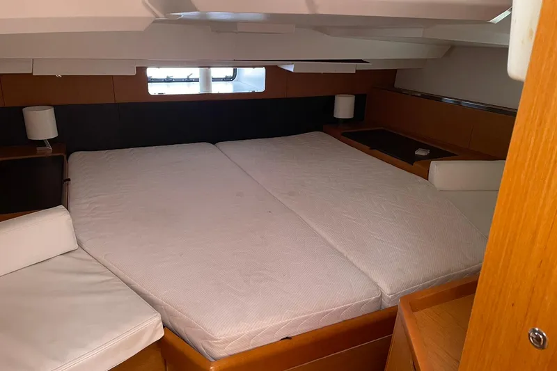 Slide: The Image of Interior cabin of 2016 Jeanneau Sun Odyssey 44 DS with double bed and modern decor. - 11