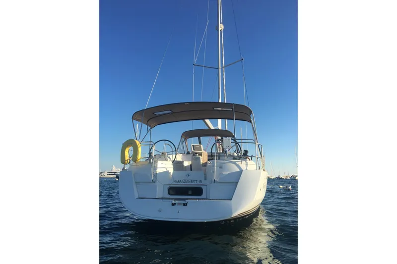 Slide: The Image of 2016 Jeanneau Sun Odyssey 44 DS sailboat on calm water, rear view. - 3