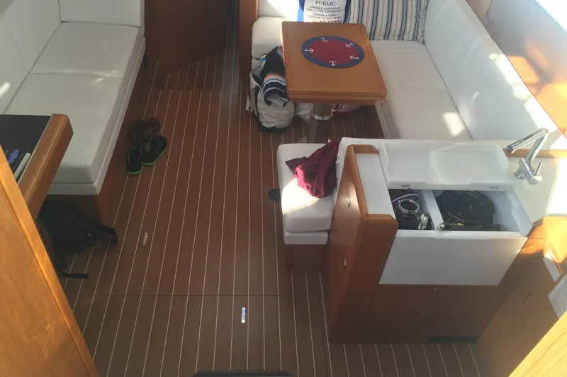 Slide: The Image of Interior of 2016 Jeanneau Sun Odyssey 44 DS yacht with seating and kitchenette. - 8