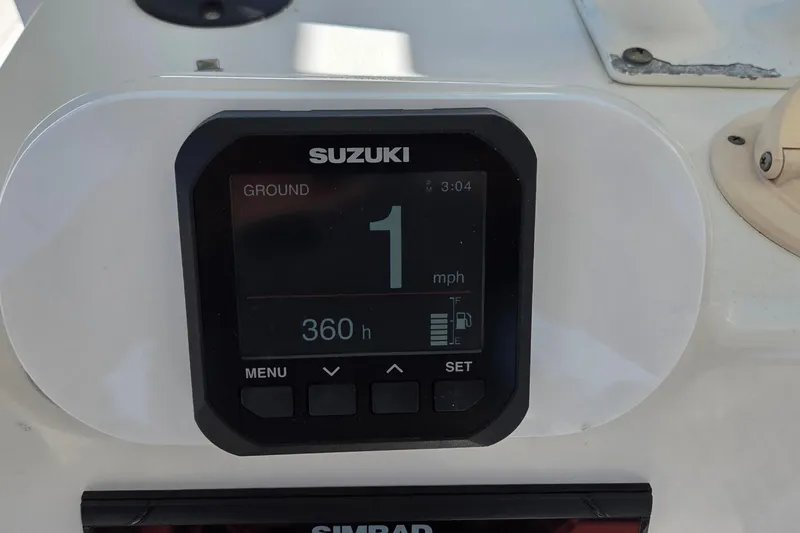 Slide: The Image of Suzuki digital display on 2005 Everglades 223 Center Console boat, showing speed and engine hours. - 15