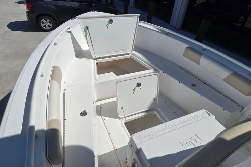 Slide: The Image of 2005 Everglades 223 Center Console boat interior with open storage compartments. - 16