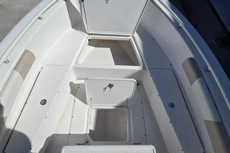 Slide: The Image of 2005 Everglades 223 Center Console boat interior with open storage compartments. - 17