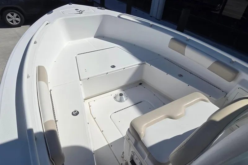 Slide: The Image of 2005 Everglades 223 Center Console boat interior with seating and storage compartments. - 20