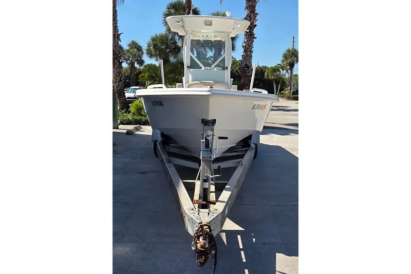 Slide: The Image of 2005 Everglades 223 Center Console boat on trailer, parked outdoors. - 3